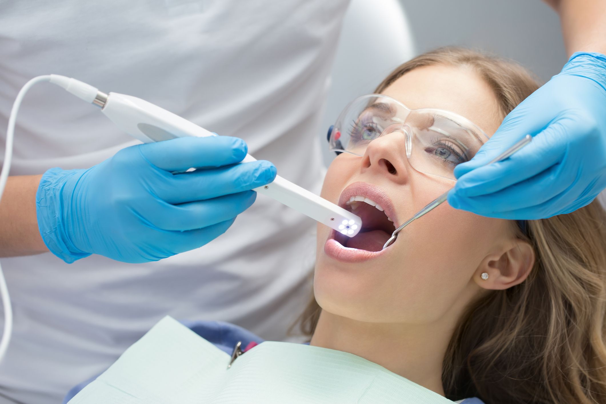 Photo of a woman undergoing an oral cancer screening